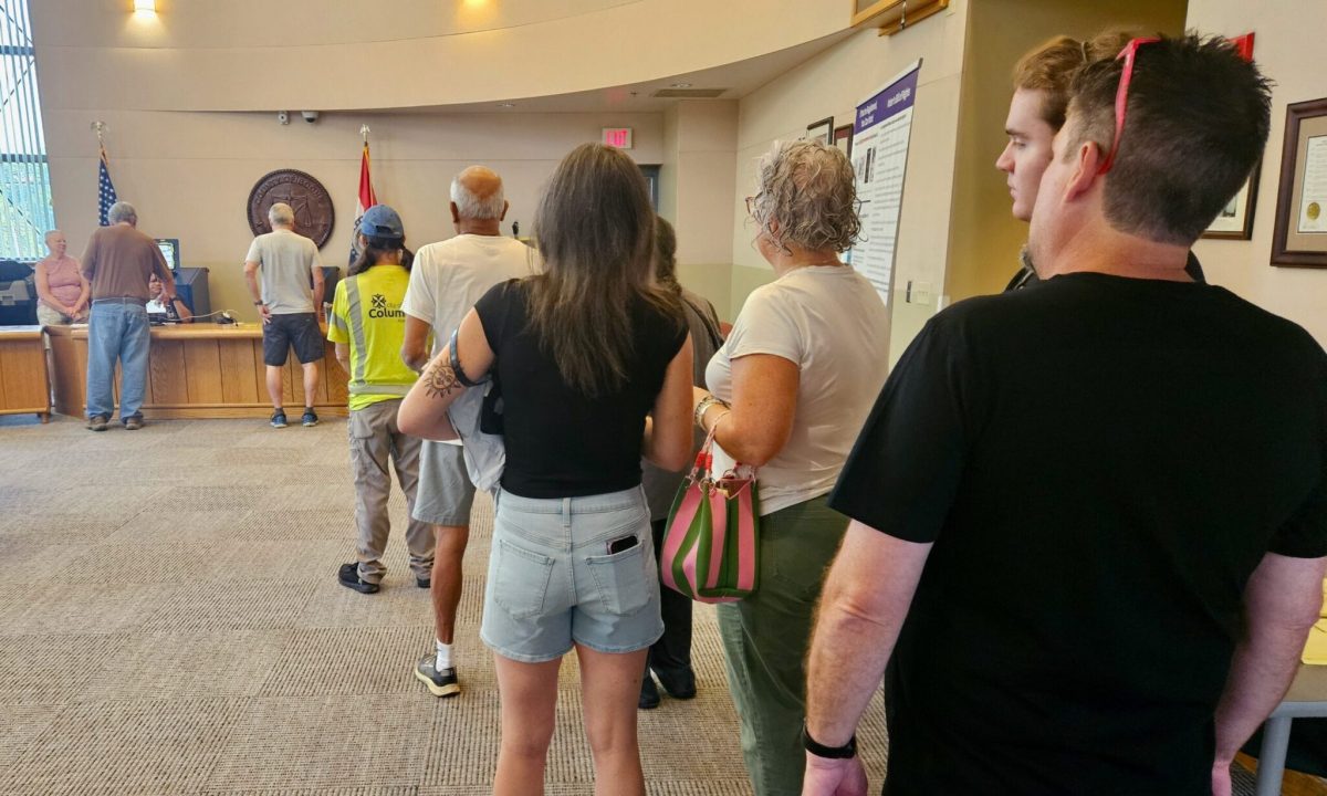 Voters line up Wednesday morning at the Roger B. Wilson Boone County Government Center in Columbia. They are using the "no excuse absentee" law to vote early in the Aug. 4 primary election (Rudi Keller/Missouri Independent).