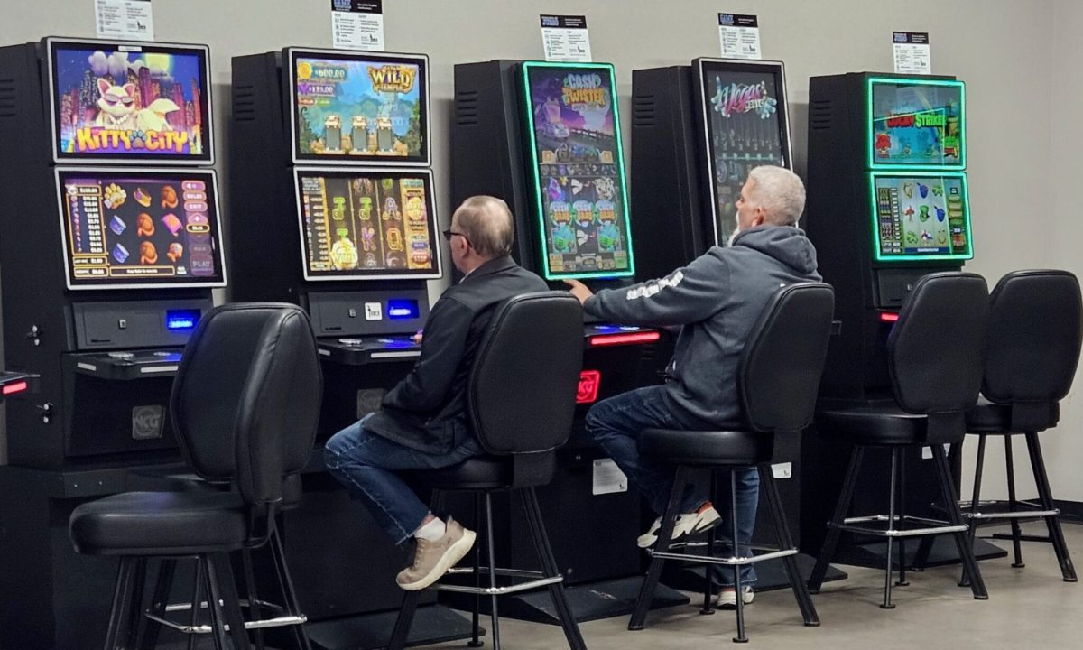Customers play Torch slot machines April 10 at a Columbia convenience store (Rudi Keller/Missouri Independent).